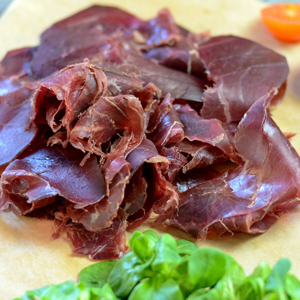 A piece of cecina from Leon (air dried and smoked cured beef made from the  hind leg of cattle from León, Spain Stock Photo - Alamy